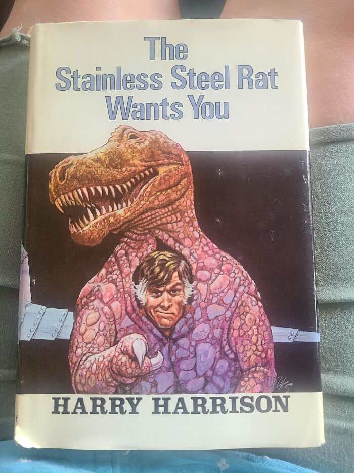 Unhinged book cover of The Stainless Steel Rat Wants You featuring a man inside a dinosaur suit
