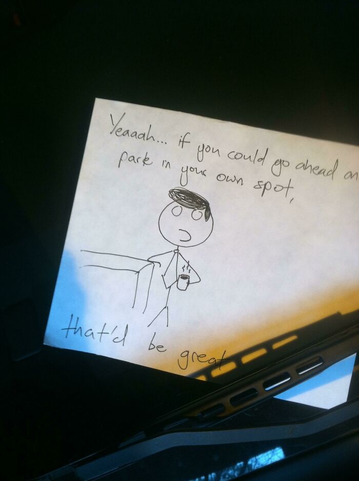 A note with a stick figure illustration, telling the jerk neighbor to park in their own spot.