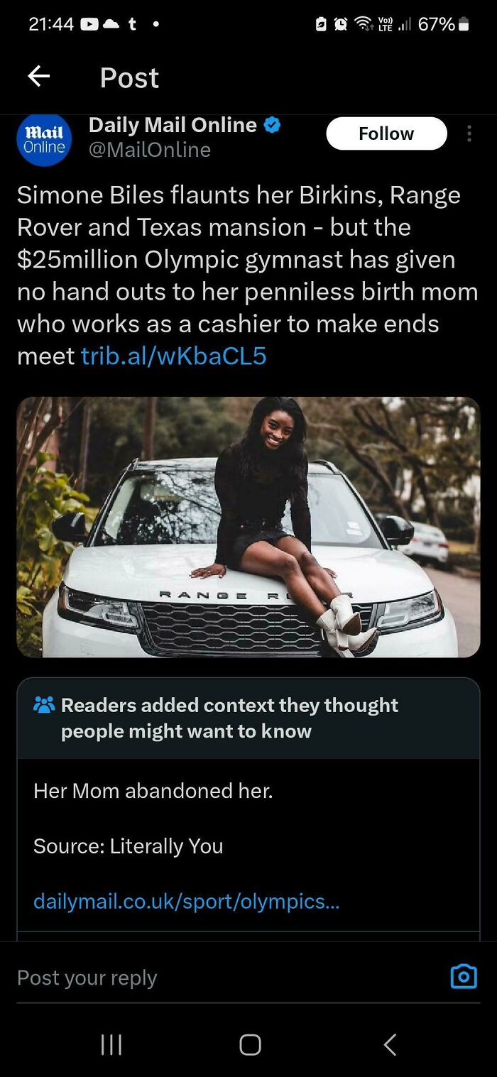 Simone Biles sitting on a white Range Rover, with a fact-checked note clarifying her mother abandoned her.