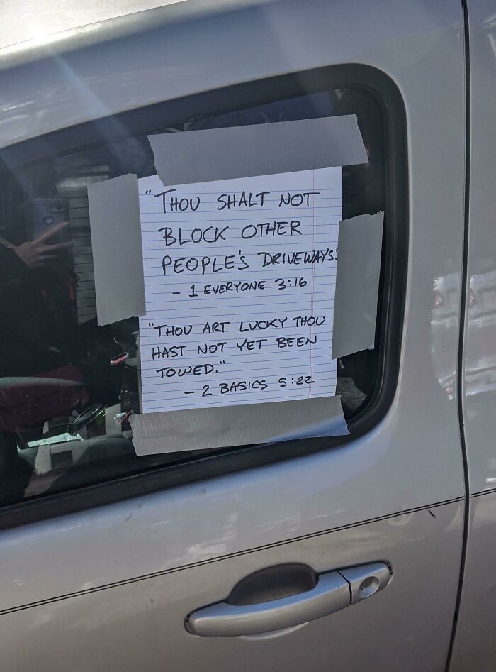 Notes taped to a car window about blocking driveways, a lesson in parking from jerk neighbors.