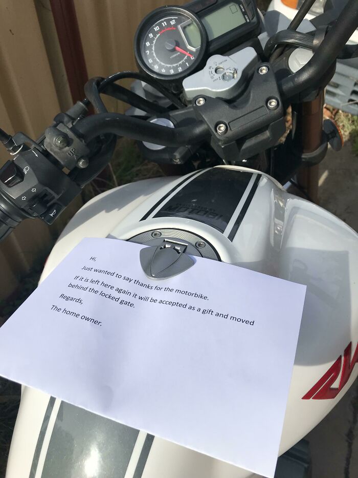 A note left on a motorbike, a lesson in parking from jerk neighbors.