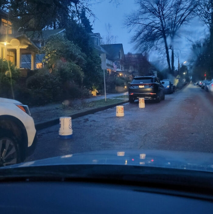 Buckets in the road blocking parking, a common sense issue among jerk neighbors.