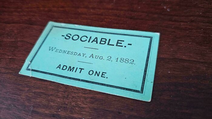An old teal Sociable ticket dated August 2, 1882, a historical piece of ephemera from the past.