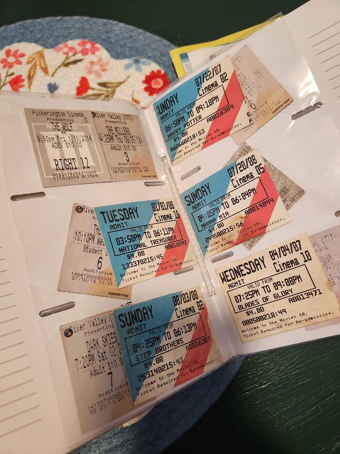 A binder page filled with various movie tickets, showcasing how much ephemera from the past has changed.