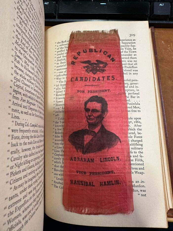 Historical ephemera: A red Republican Candidates ribbon featuring Abraham Lincoln and Hannibal Hamlin.