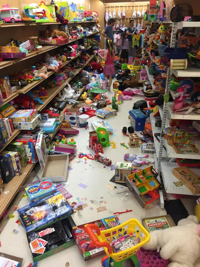 A toy store aisle left in complete disarray, a chaotic scene parents often face.