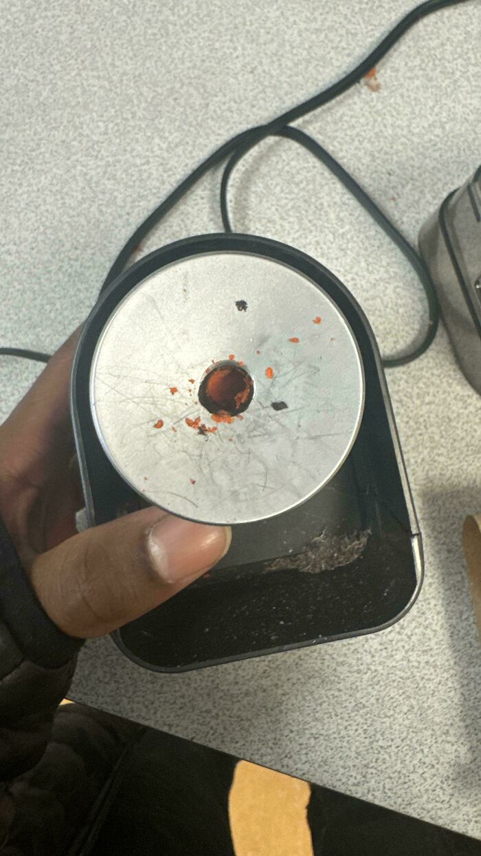A pencil sharpener filled with crayon shavings, showing a common challenge for parents.
