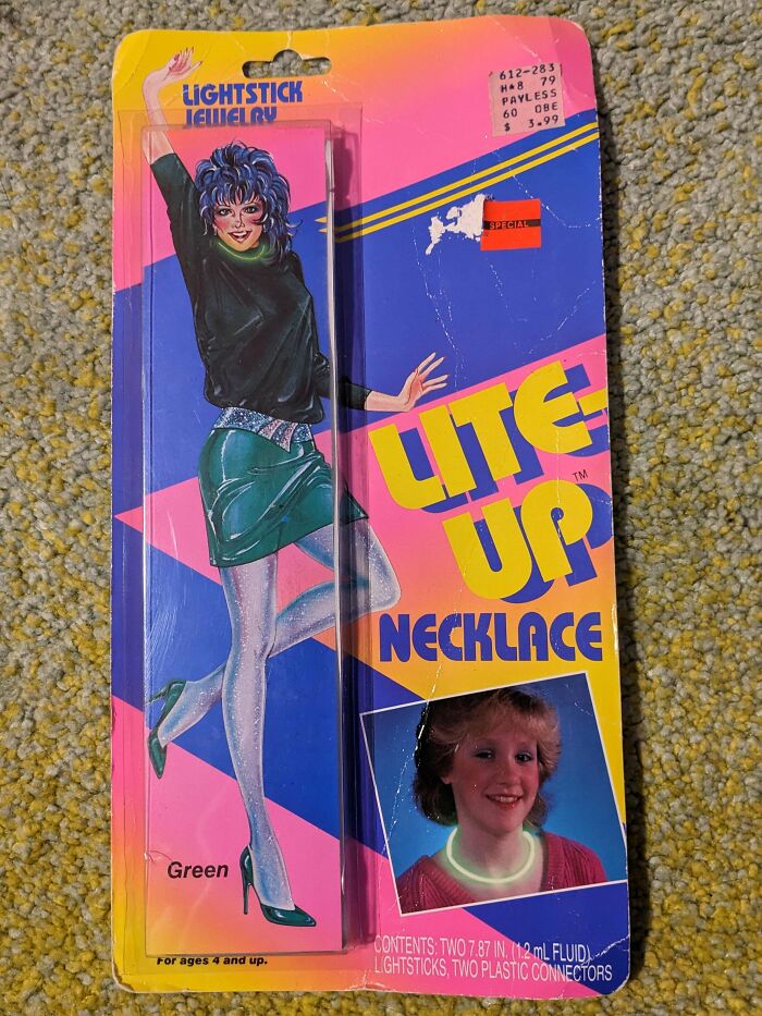 Vintage Lightstick Jewelry package with a woman in a green outfit, showing ephemera from the past.