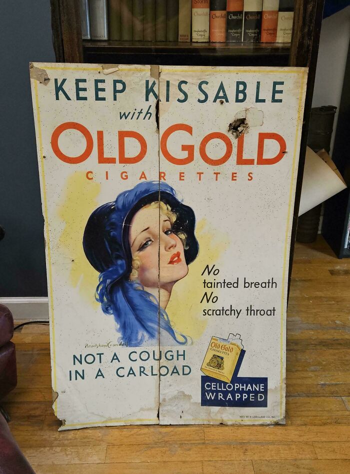 An old colorful advertisement for Old Gold Cigarettes with a woman's face, a piece of ephemera showing how much the past has changed.