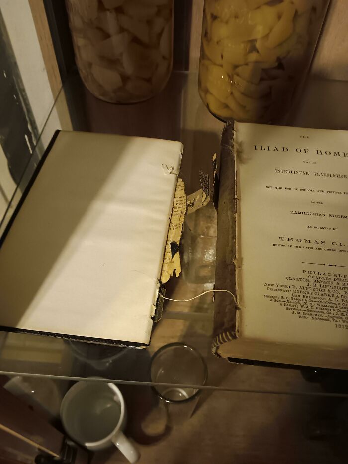 A damaged old book, showcasing a destructive moment that challenges parents.