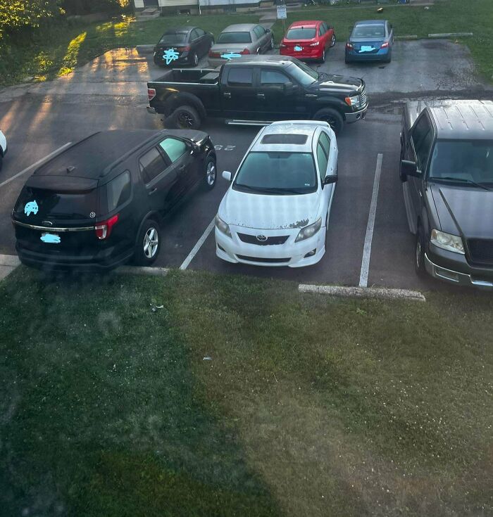 Several cars poorly parked, demonstrating bad parking and lack of common sense by neighbors.
