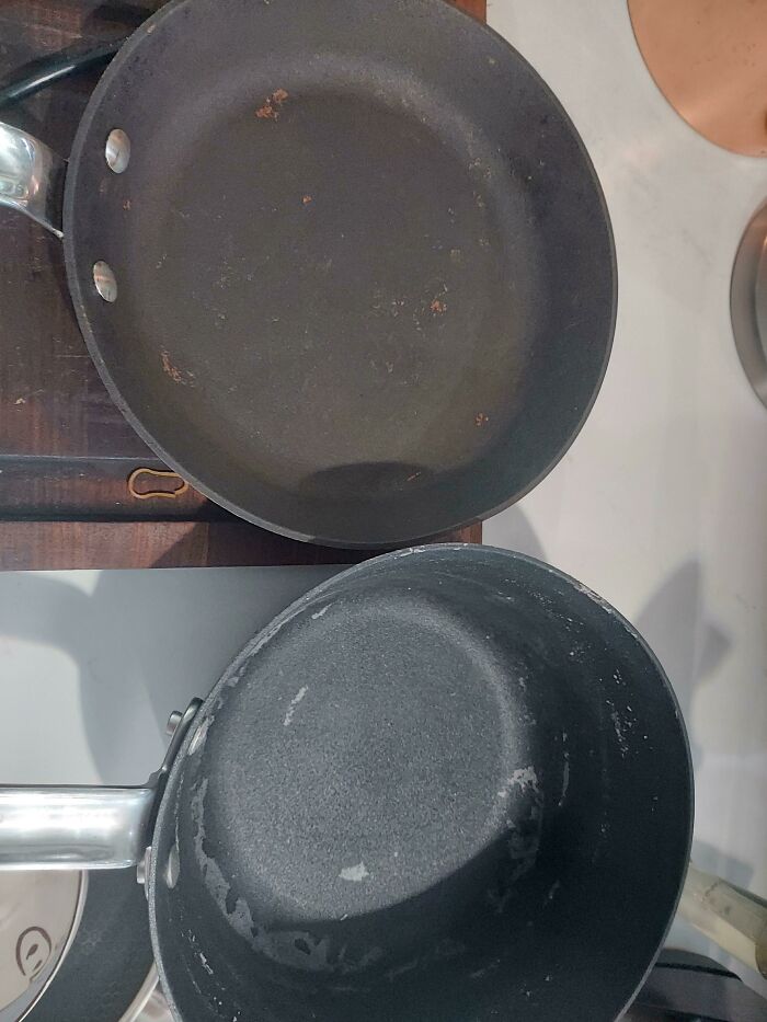 Dirty, uncleaned pans making becoming a cat lady look more attractive.