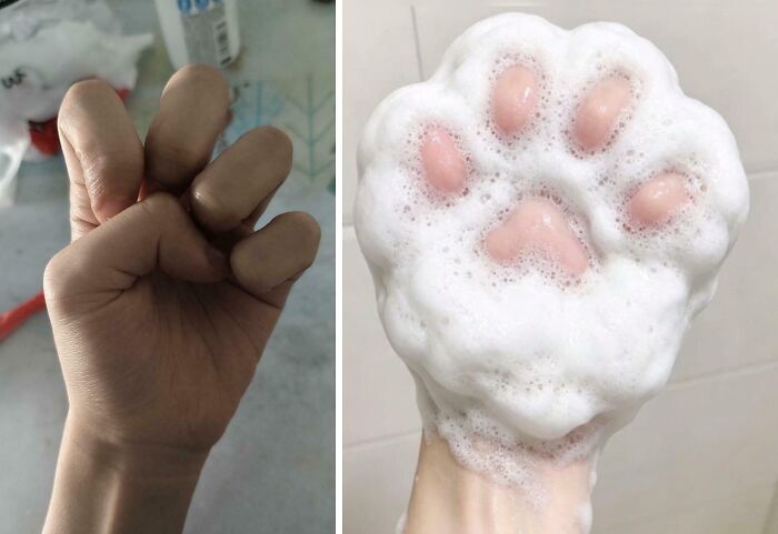 A human hand with fingers bent, beside a hand covered in soap suds shaped like a cat's paw, creating a perplexing pic.