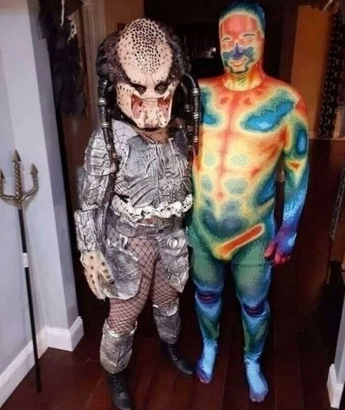 Two people in Halloween costumes: one as a Predator, the other in a thermal body suit revealing body heat. Cannot Explain Pics.