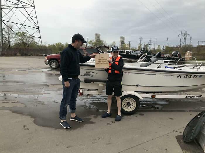 A man presenting an award for trash fishing, emphasizing the issue of trash and the people making a difference.