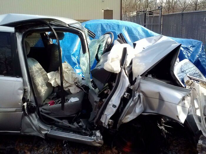 A severely damaged car after an accident, a stark reminder of the impact of scientific facts.