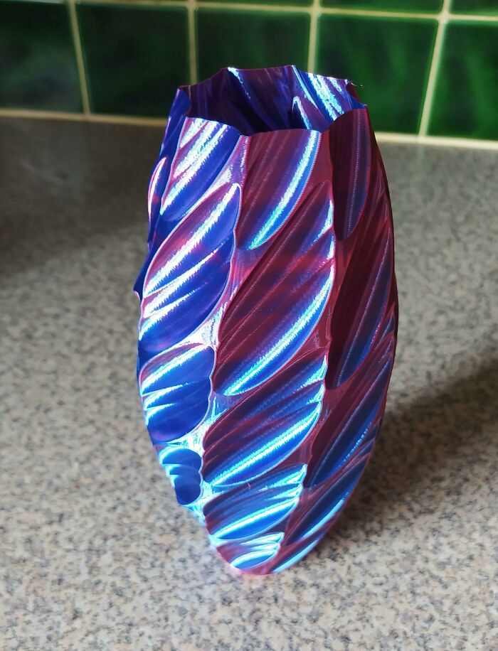 A vibrant, multi-colored vase with intricate patterns, showcasing brilliant things made with 3D printers.