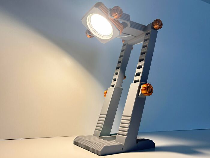 A unique 3D printed desk lamp with an adjustable, articulated design.