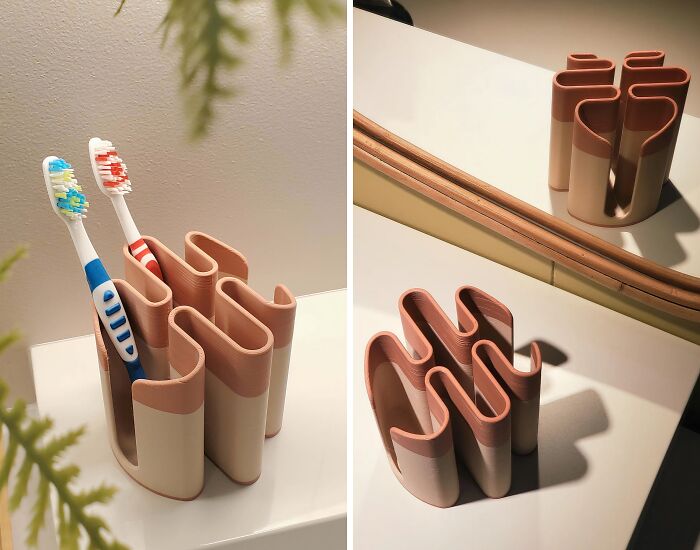A stylish, two-toned toothbrush holder created with a 3D printer, adding a unique touch to bathroom decor.