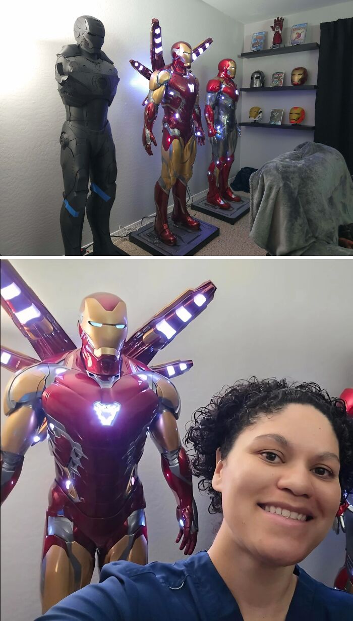 A person smiling next to a detailed Iron Man suit display, one of many brilliant things created with 3D printers.