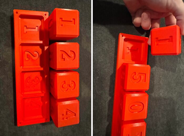 A set of interlocking orange numbered blocks created with 3D printers.