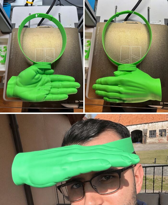 A person wearing a brilliant 3D printed green hand-shaped visor, demonstrating the versatility of 3D printers.