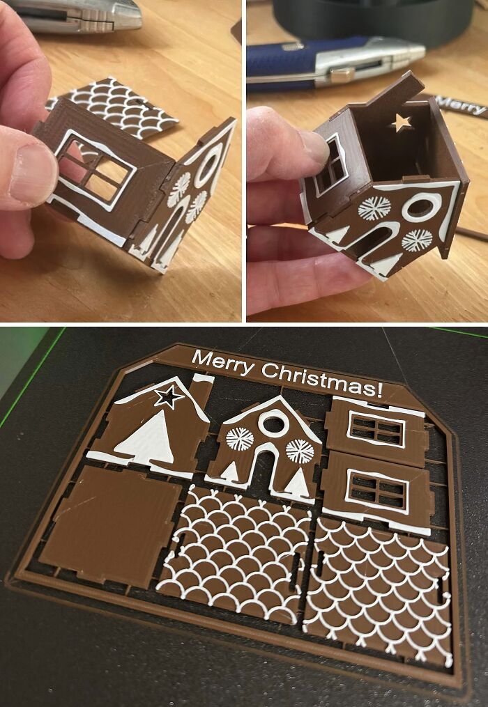 Hands assembling a small 3D printed gingerbread house, with a flat sheet of components labeled Merry Christmas, showing brilliant things made with 3D printers.