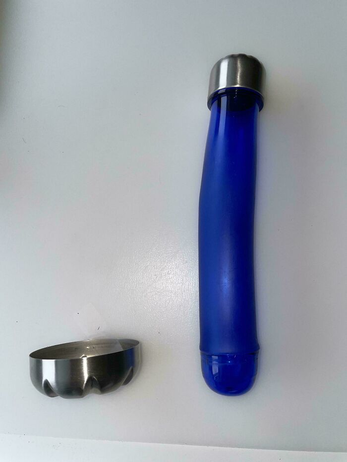 A wild, wonderful blue bottle and metal bowl. This strange pairing highlights the weird and wonderful nature of the world.