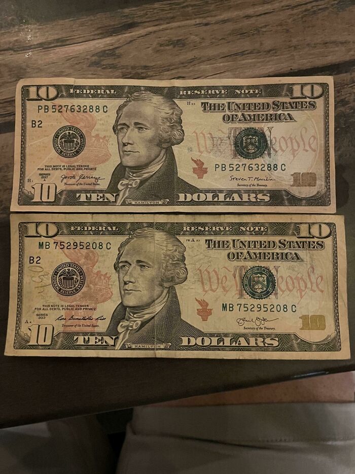 Two US ten-dollar bills, one upside down, showing the weird and wonderful world of currency.