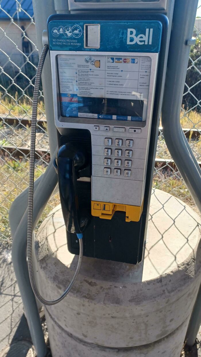 A Bell payphone, a wonderful and weird sight in today's world, stands as a reminder of past communication methods.