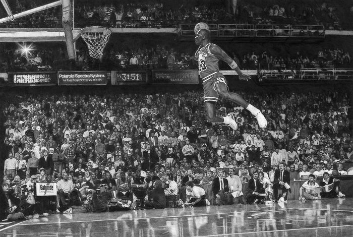 Michael Jordan mid-air dunk in a packed arena, a wild picture capturing a wonderful world of sports.
