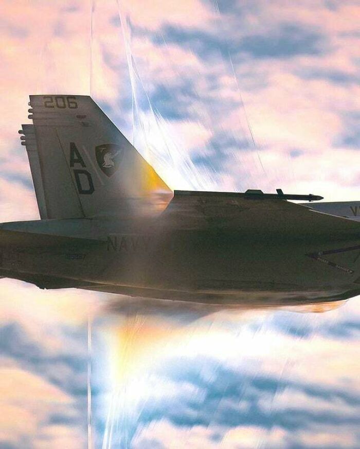 A dramatic image of a fighter jet flying through the clouds, highlighting the wonderful and wild world.