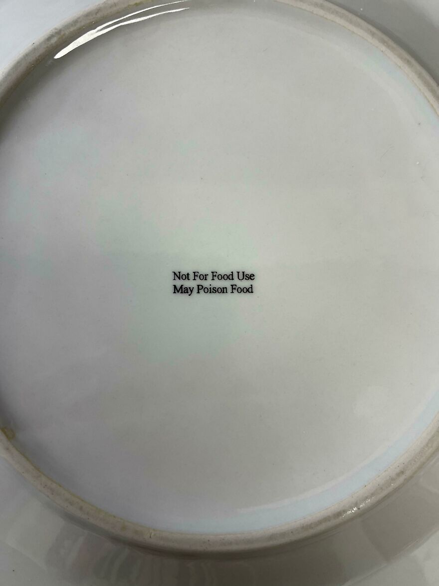 A funny plate with a warning message: Not For Food Use, May Poison Food, an unfortunate regret.
