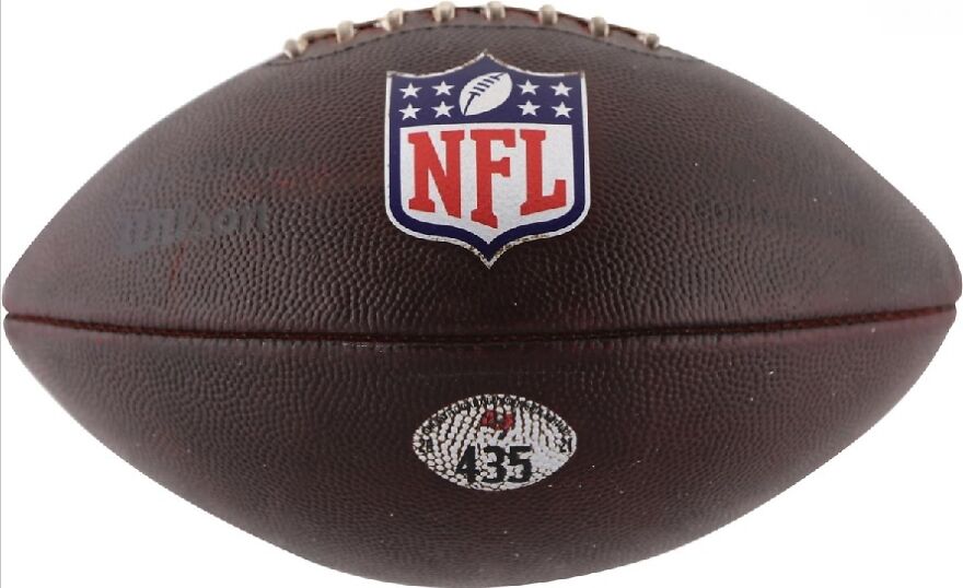 A brown NFL football, a funny unfortunate fail for a sports fan.