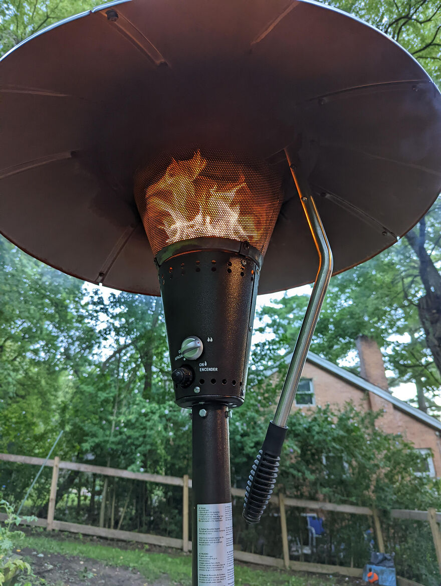 A patio heater with a flame, representing a cozy side hustle setup for making extra dough.