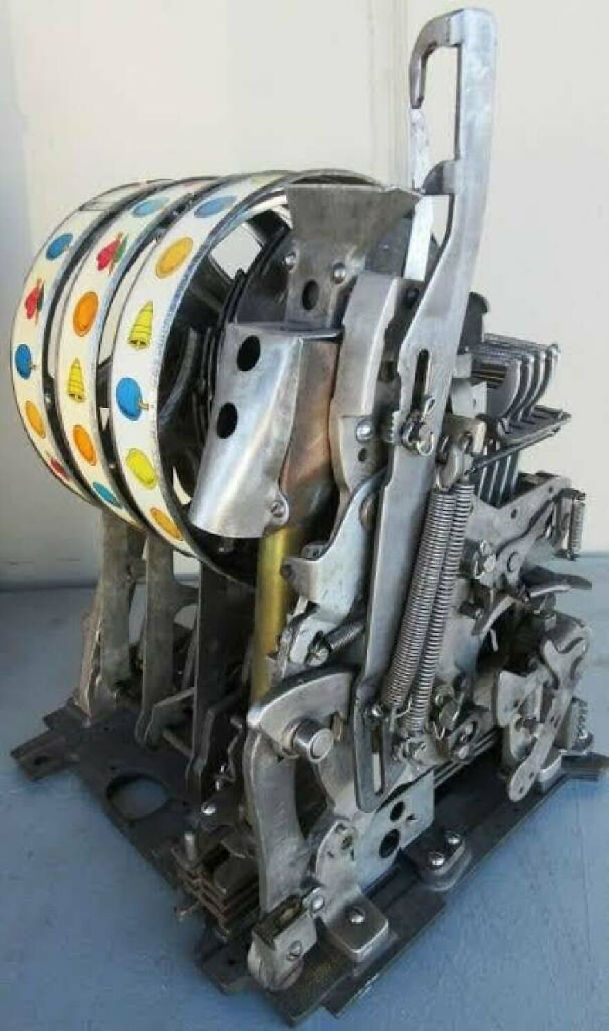 An intricate, exposed mechanism of a vintage slot machine, possibly part of a unique side hustle in restoration.