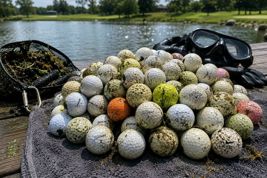 A pile of golf balls retrieved from water, an example of a weird side hustle.