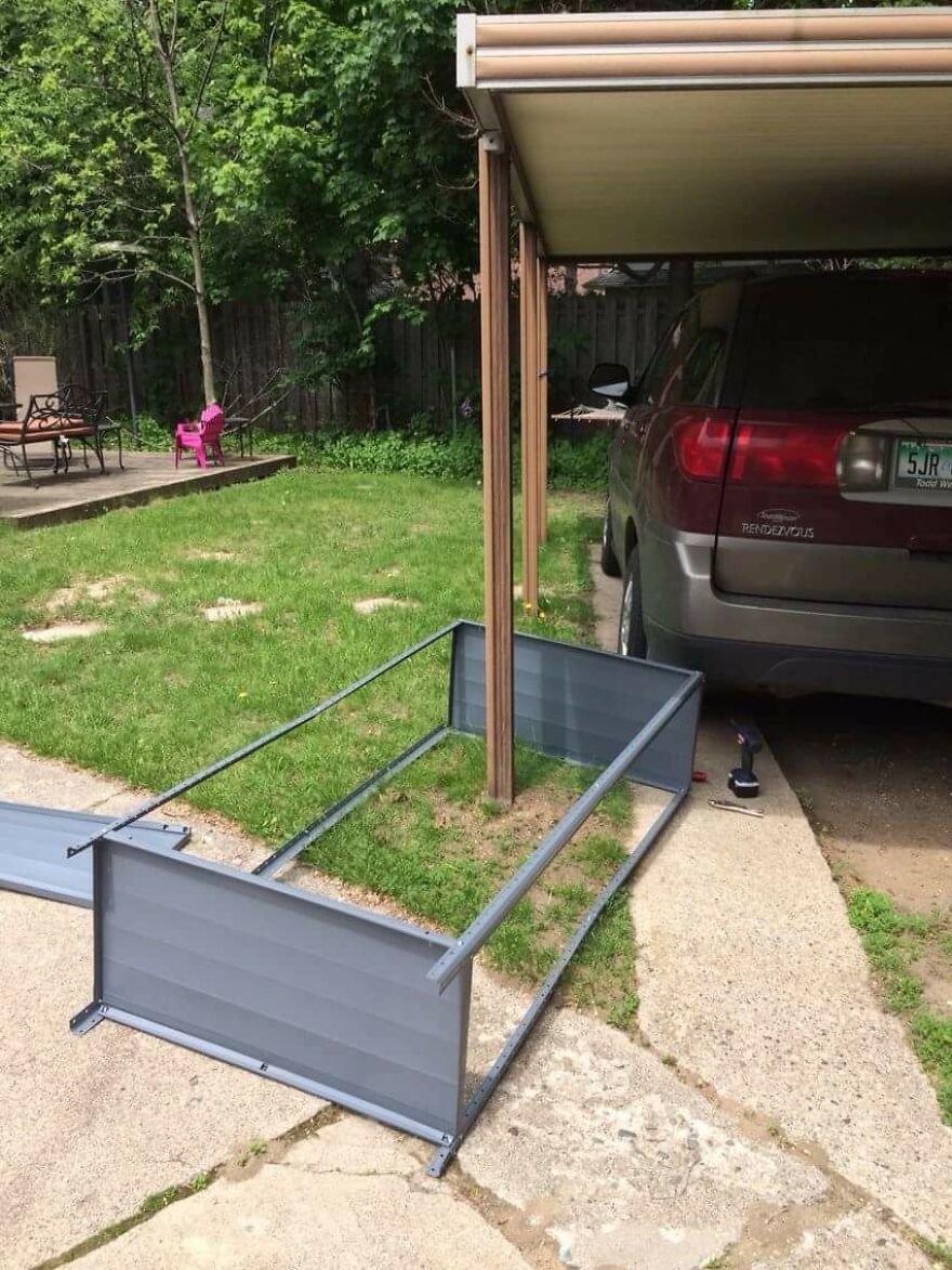 A carport pillar installed through the middle of a metal storage shed frame, a funny fails moment.