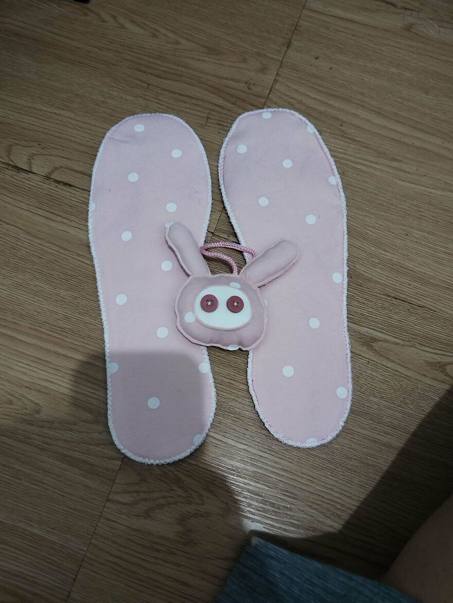 Pink polka-dot shoe insoles with a cute bunny charm, a unique item that could be part of a weird side hustle.