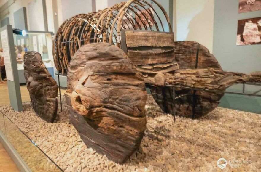 Strange things happening on Earth: wooden boat wreckage displayed in a museum exhibit, pieces of an ancient vessel.