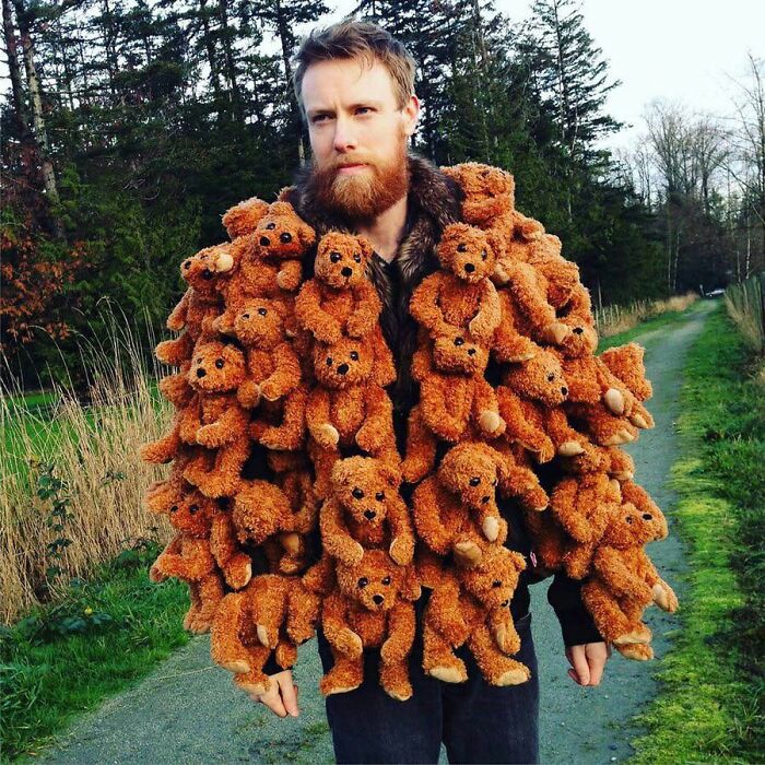 Man wearing a jacket covered in multiple teddy bears in a hilarious fashion crime outfit