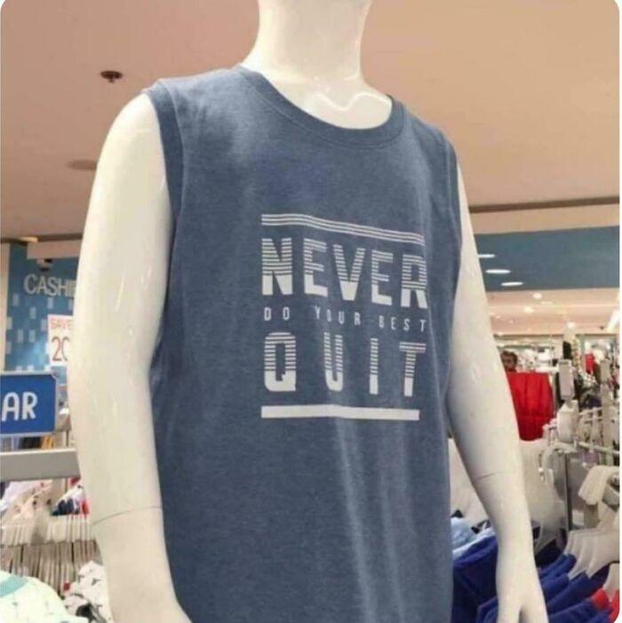 A mannequin wearing a blue tank top with the text 'NEVER DO YOUR BEST QUIT', a bad fashion crime.