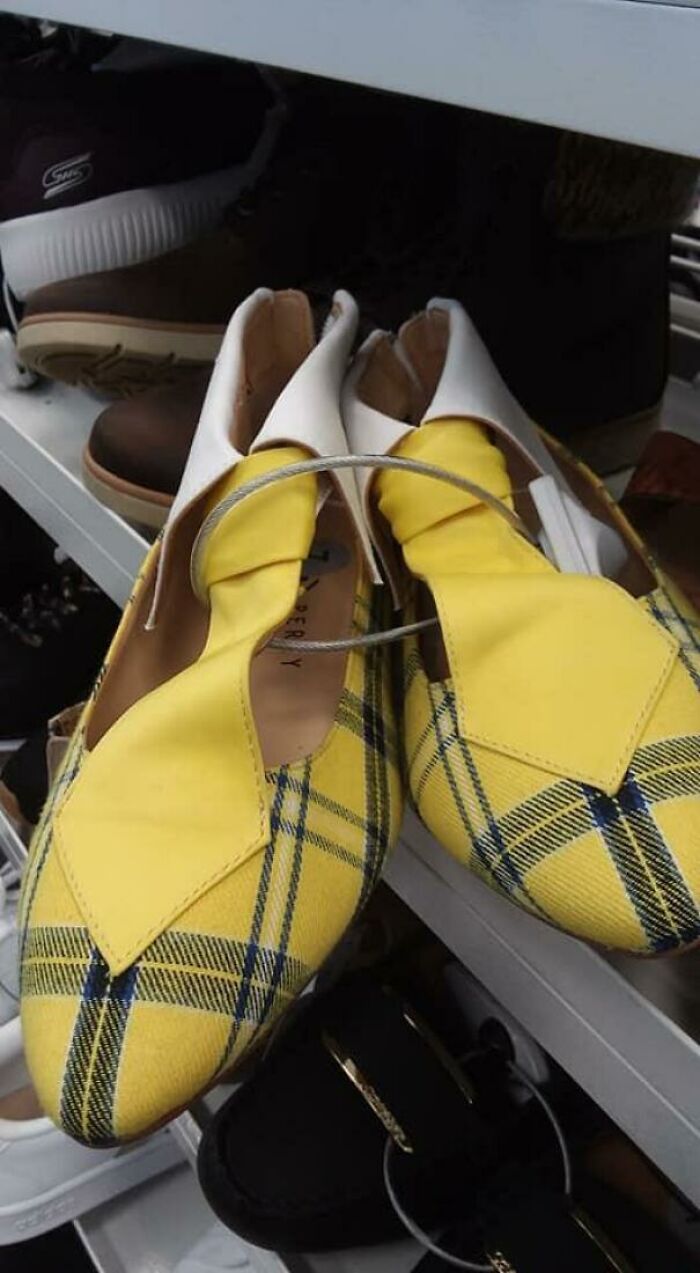 Yellow and blue plaid shoes with an unusual T-strap design, a hilariously bad fashion crime on display.