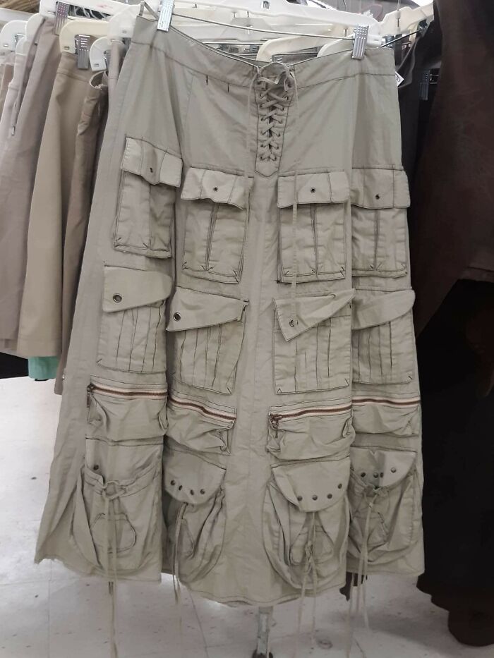 A long, multi-pocketed cargo skirt, a hilariously bad fashion crime hanging on a rack.