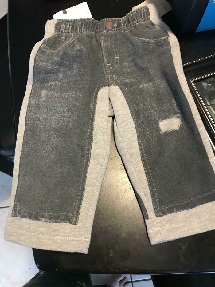 Hilariously bad fashion crime of sweatpants designed to look like jeans with ripped knees.