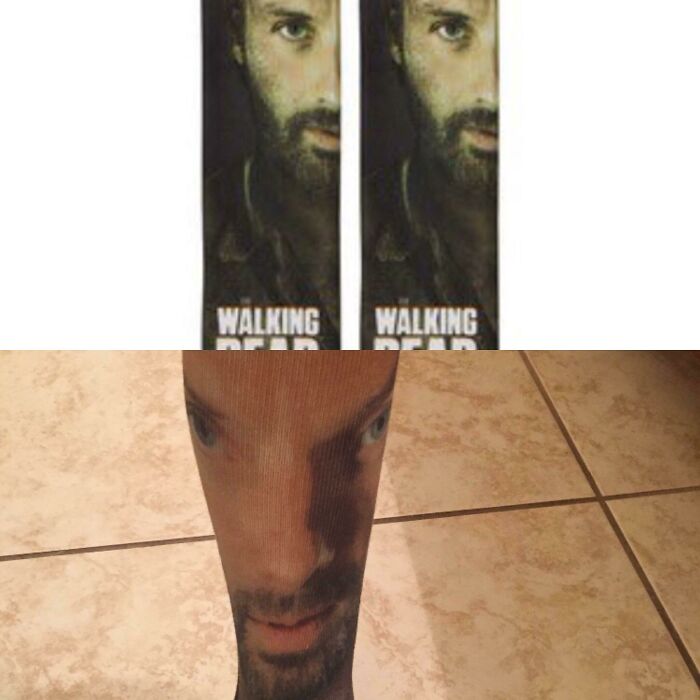A pair of hilariously bad fashion crime socks featuring a distorted face design on a person's legs.