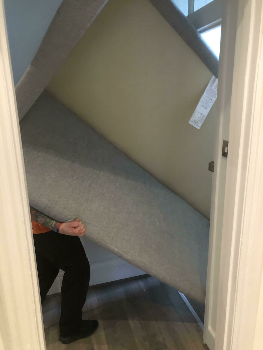 A large bed frame stuck in a doorway, a funny unfortunate regret fail.