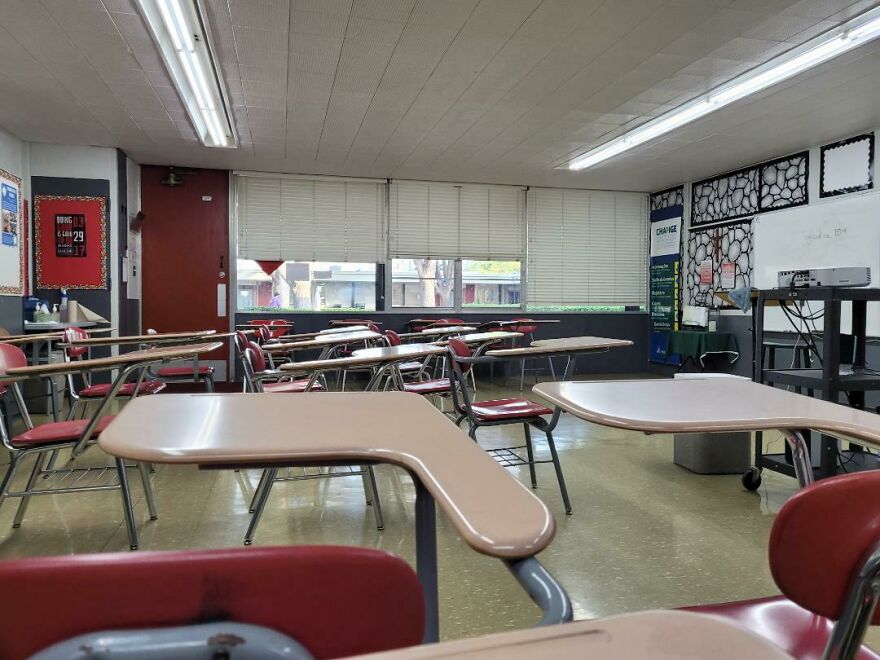Empty classroom with desks and chairs, a common regret for students missing school. Funny fails.