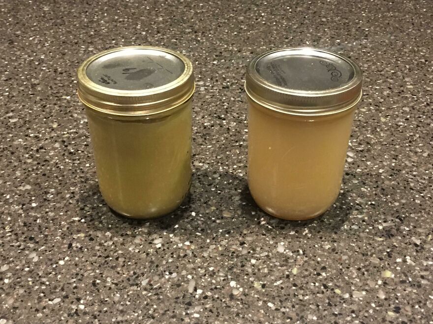 Two glass jars with different colored liquids on a dark countertop. Funny kitchen fails.