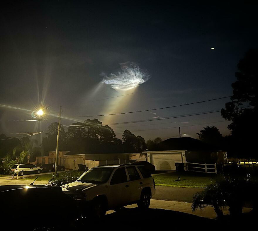 Night sky with a strange phenomenon, possibly a rocket launch, illuminating the dark, incredible things happening.